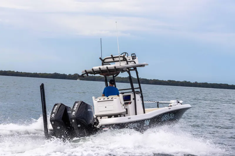 Slide: The Image of 2022 Caymas 281HB Center Console boat cruising on open water. - 31