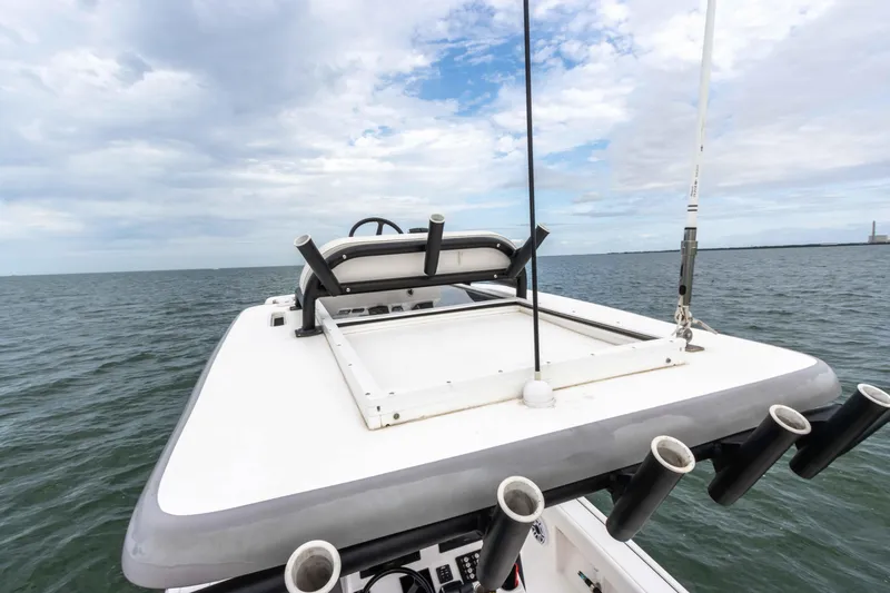 Slide: The Image of 2022 Caymas 281HB Center Console boat on open water. - 38