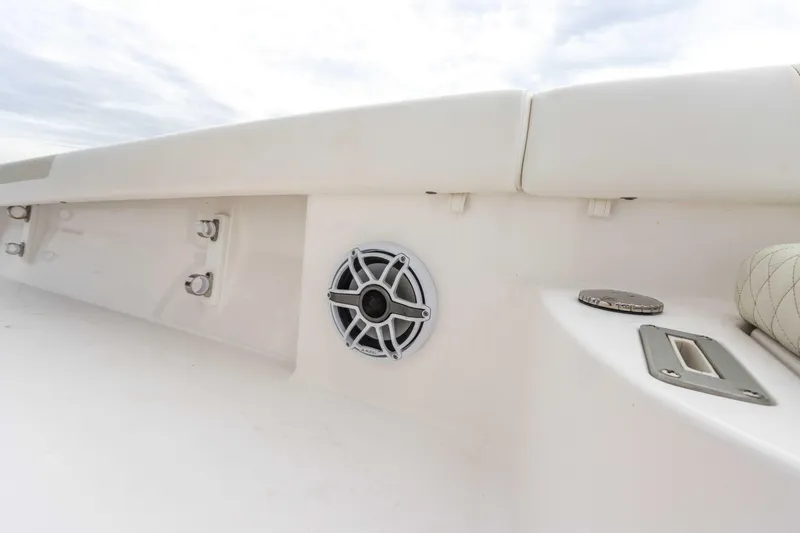 Slide: The Image of 2022 Caymas 281HB Center Console boat interior with speaker and seating. - 39