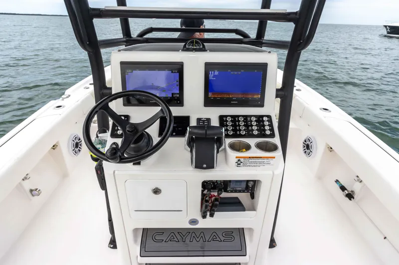 Slide: The Image of 2022 Caymas 281HB Center Console boat dashboard with navigation screens and controls. - 41