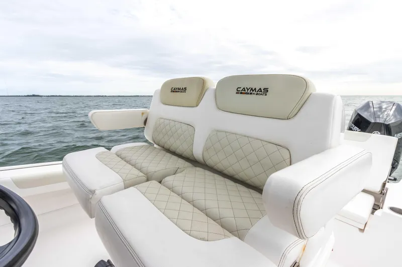 Slide: The Image of 2022 Caymas 281HB Center Console boat seats with diamond-stitched upholstery. - 46