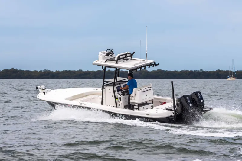 Slide: The Image of 2022 Caymas 281HB Center Console boat cruising on open water. - 7