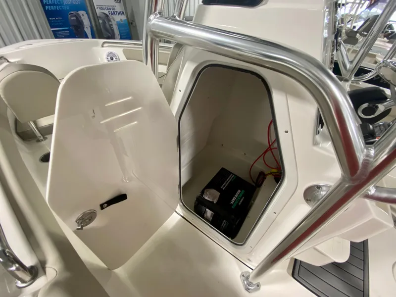 Slide: The Image of 2024 Key West 203 FS boat battery compartment with open hatch. - 13