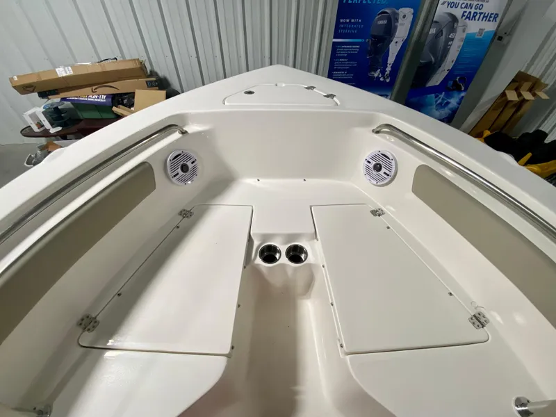 Slide: The Image of 2024 Key West 203 FS boat interior with storage compartments and speakers. - 18