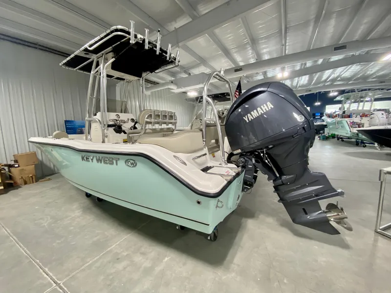 Slide: The Image of 2024 Key West 203 FS boat with Yamaha outboard motor in showroom. - 3