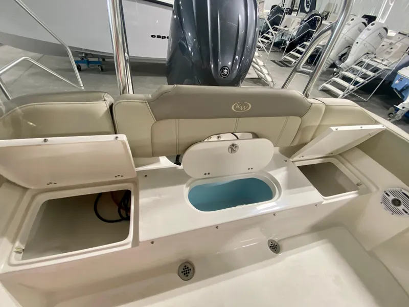 Slide: The Image of 2024 Key West 203 FS boat interior with storage compartments and seating. - 7