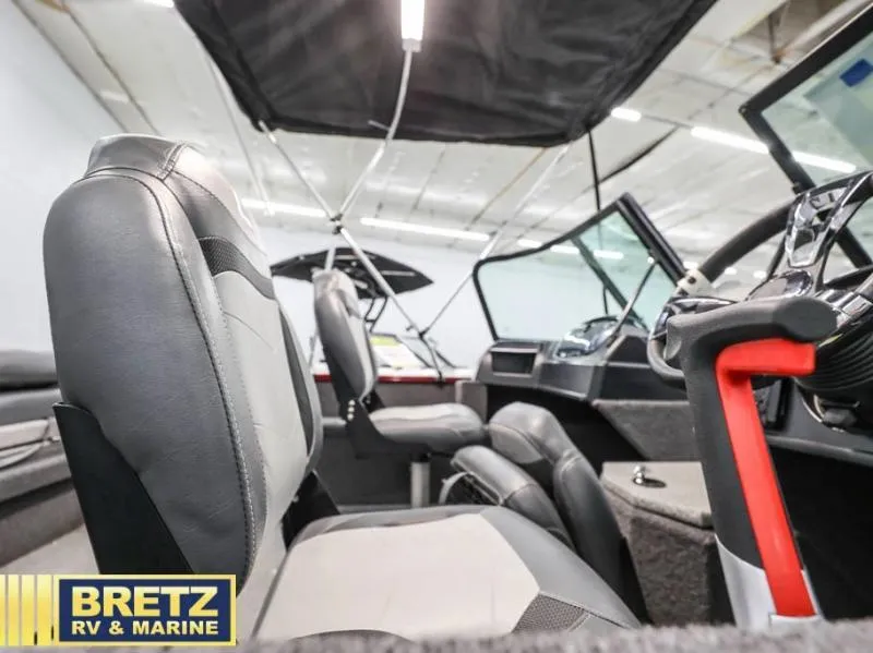 Slide: The Image of 2024 Fishing Machine 1775 WT interior with seating and steering wheel, showcased at Bretz RV & Marine. - 13