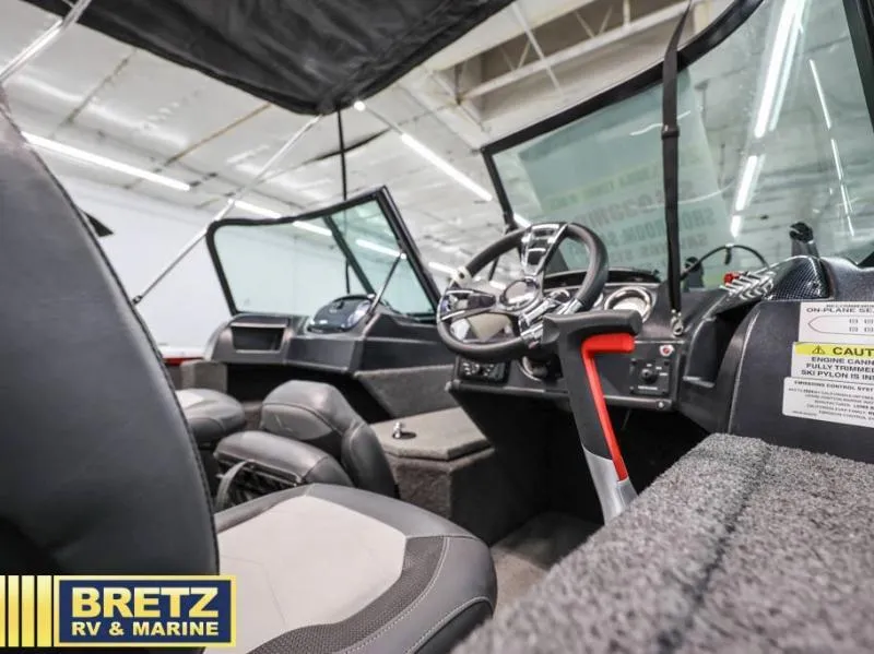 Slide: The Image of 2024 Fishing Machine 1775 WT boat interior with steering wheel and seating. - 14