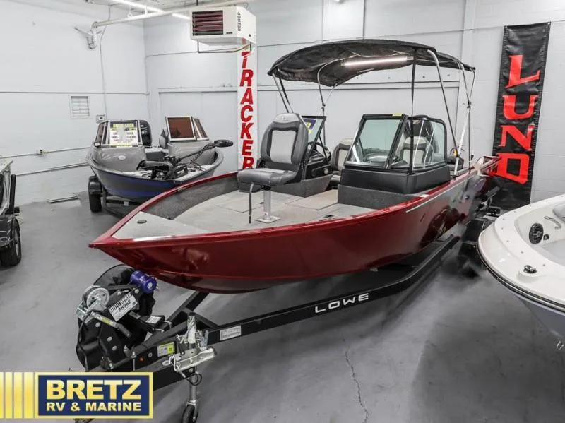 Slide: The Image of 2024 Fishing Machine 1775 WT boat in showroom, red exterior, displayed at Bretz RV & Marine. - 5