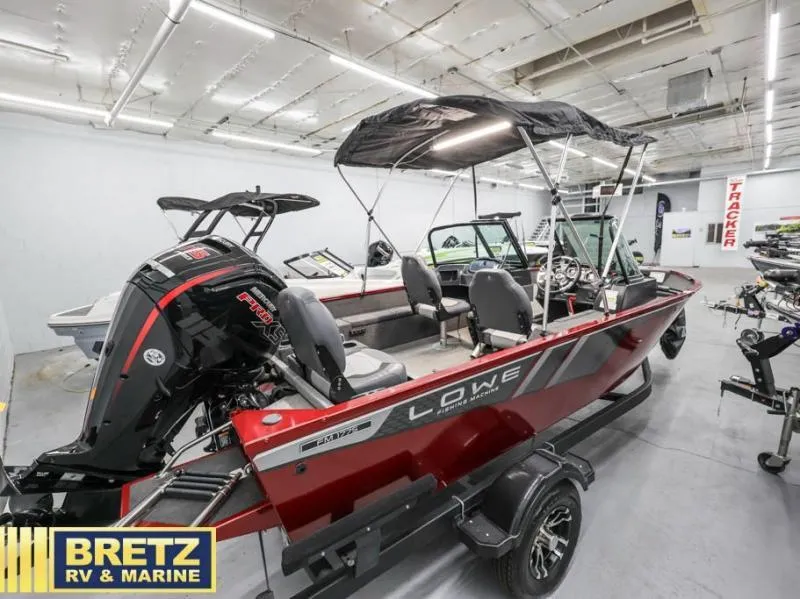 Slide: The Image of 2024 Fishing Machine 1775 WT boat in showroom, featuring sleek design and powerful engine. - 6