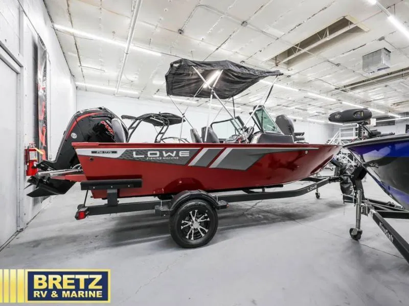 Slide: The Image of 2024 Fishing Machine 1775 WT boat in showroom, red exterior, displayed at Bretz RV & Marine. - 9