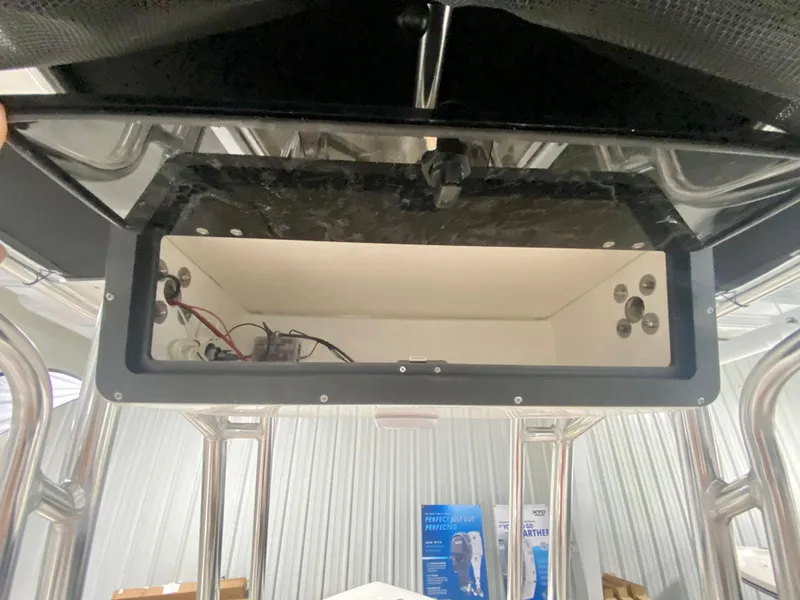 Slide: The Image of 2024 Key West 203 FS boat console storage compartment. - 11