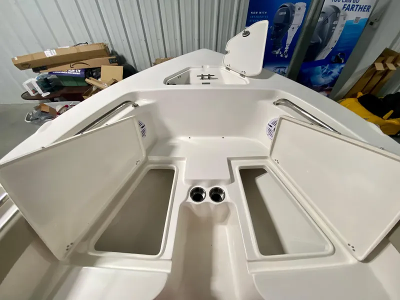 Slide: The Image of 2024 Key West 203 FS boat interior with open storage compartments. - 19