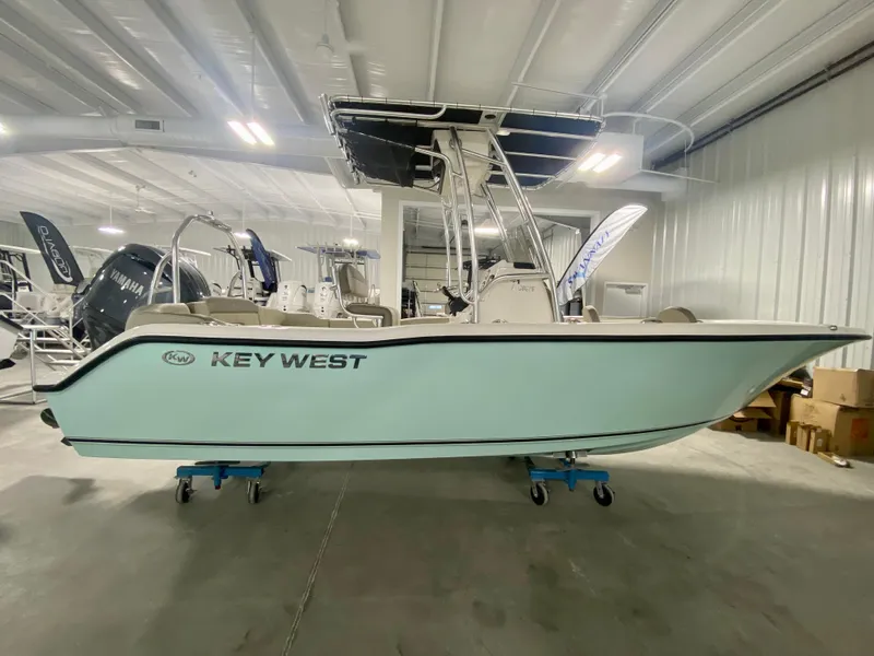 Slide: The Image of 2024 Key West 203 FS boat in showroom. - 2
