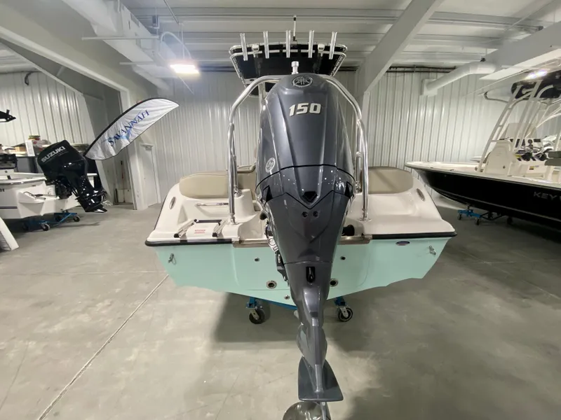 Slide: The Image of 2024 Key West 203 FS boat with 150 HP engine in showroom. - 4