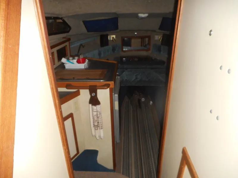 Slide: The Image of Interior of a 1984 Beachcraft Cabin Cruiser with kitchen and sleeping area. - 11