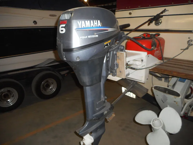 Slide: The Image of Yamaha 6HP four-stroke outboard motor on a 1984 Beachcraft Cabin Cruiser. - 4