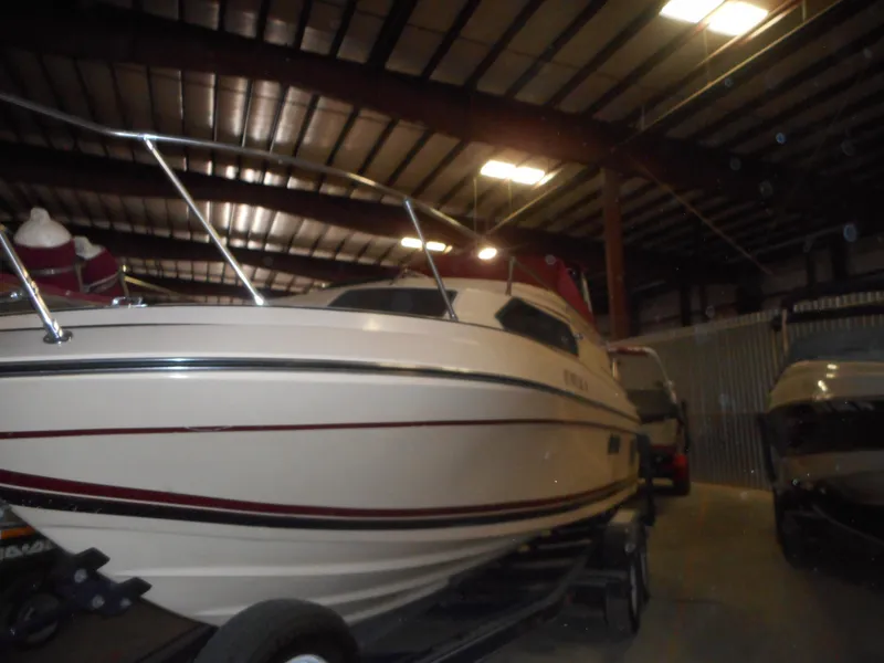 Slide: The Image of 1984 Beachcraft Cabin Cruiser in indoor storage facility. - 5