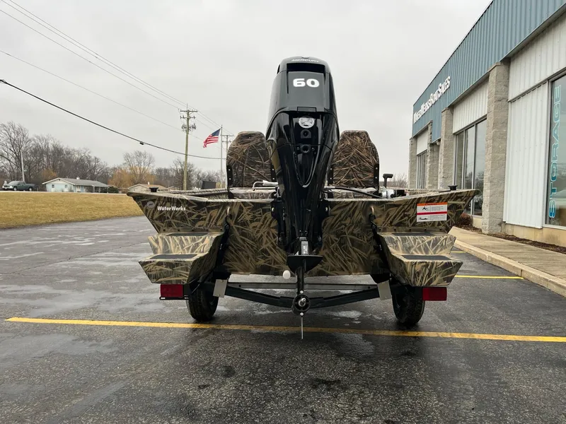 Slide: The Image of 2024 Lowe Roughneck RX1660 SC boat with Mercury engine on trailer. - 2