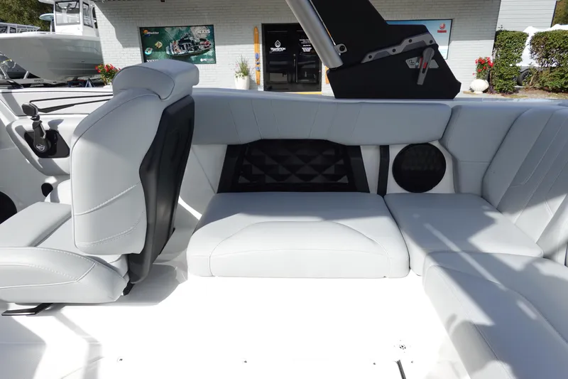 Slide: The Image of 2024 Malibu 21 LX-R boat interior with white leather seating and modern design. - 17