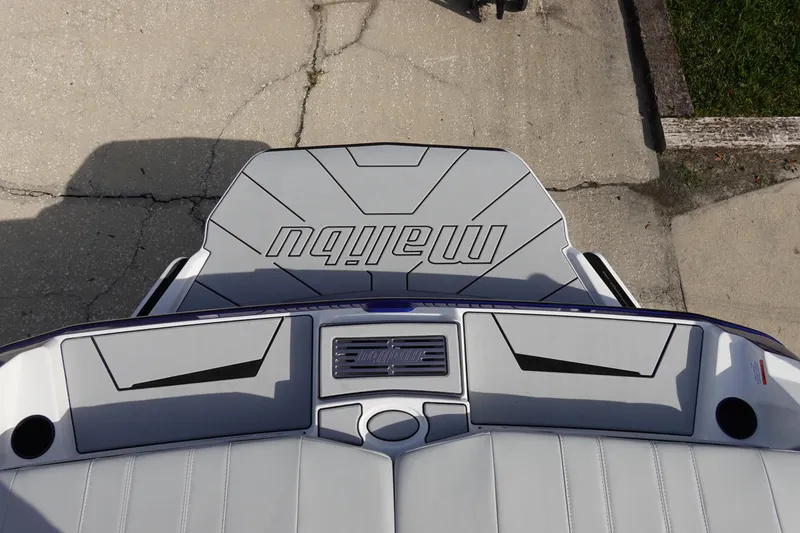 Slide: The Image of 2024 Malibu 21 LX-R boat rear deck and seating area. - 25
