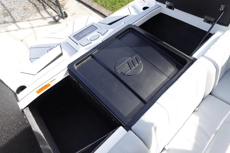 Slide: The Image of 2024 Malibu 21 LX-R boat interior storage compartments. - 26
