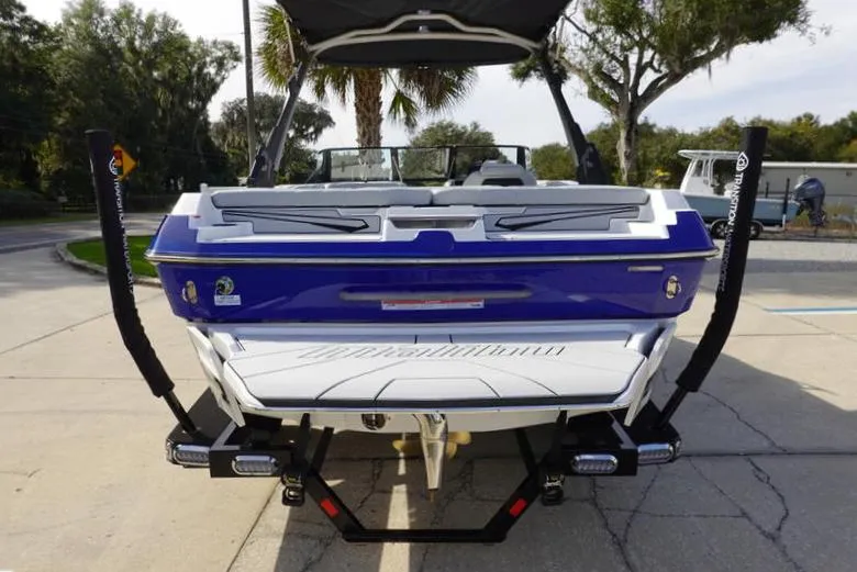Slide: The Image of 2024 Malibu 21 LX-R boat rear view on trailer. - 3