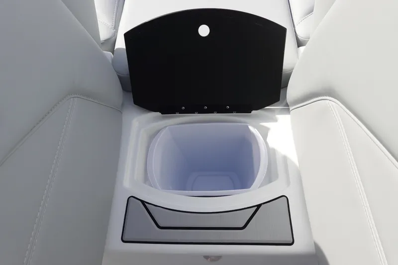 Slide: The Image of 2024 Malibu 21 LX-R boat interior cup holder and storage compartment. - 34