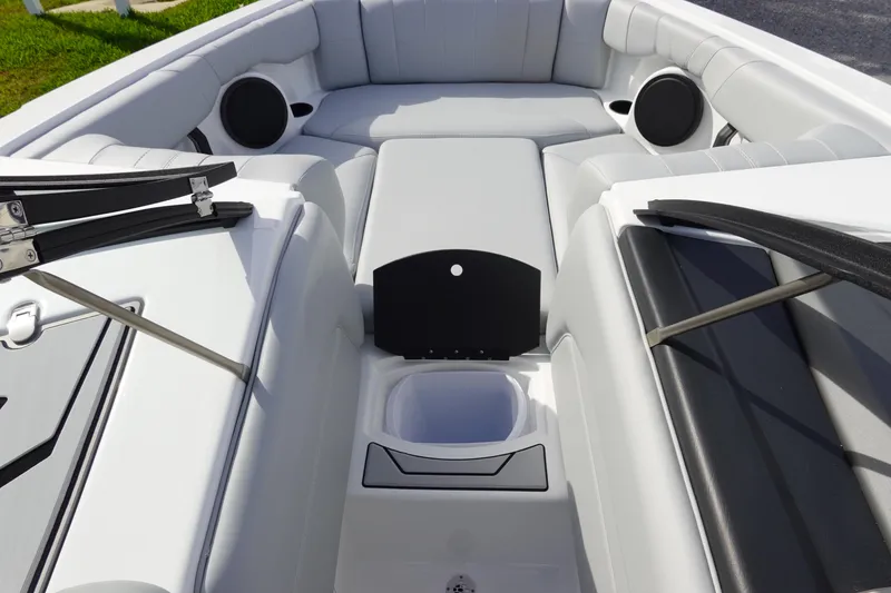 Slide: The Image of 2024 Malibu 21 LX-R boat interior with seating and storage compartments. - 35