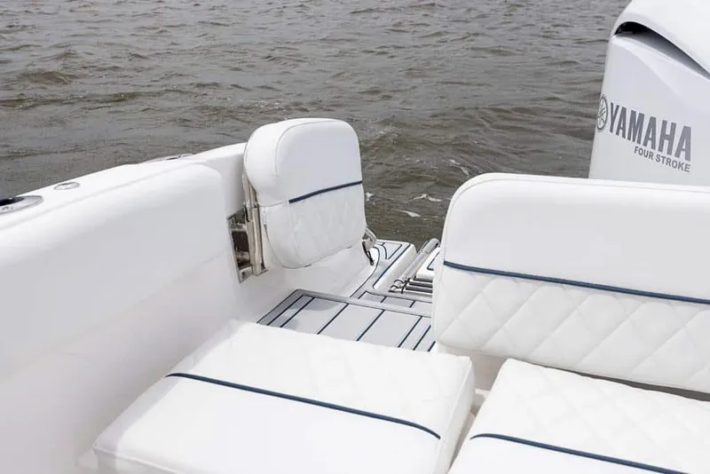 Slide: The Image of 2025 Sea Fox 228 Traveler boat with Yamaha four-stroke engine, white cushioned seating. - 14