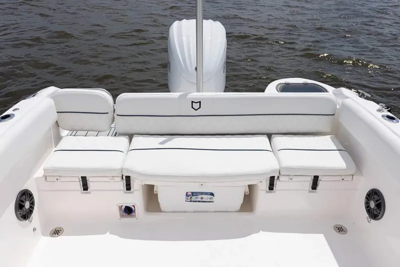 Slide: The Image of 2025 Sea Fox 228 Traveler boat interior with white cushioned seating. - 19