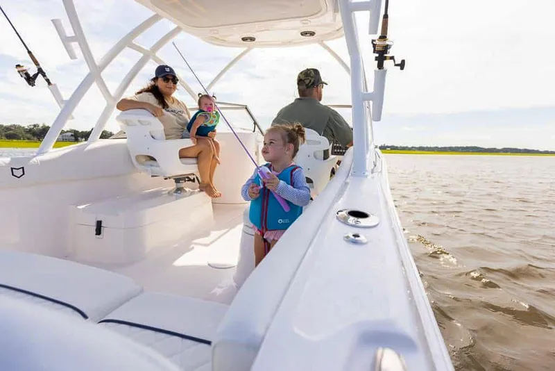 Slide: The Image of Family enjoying a day on the water in a 2025 Sea Fox 228 Traveler boat. - 7
