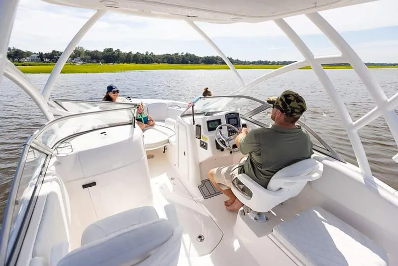 Slide: The Image of 2025 Sea Fox 228 Traveler boat cruising on a lake with passengers. - 8