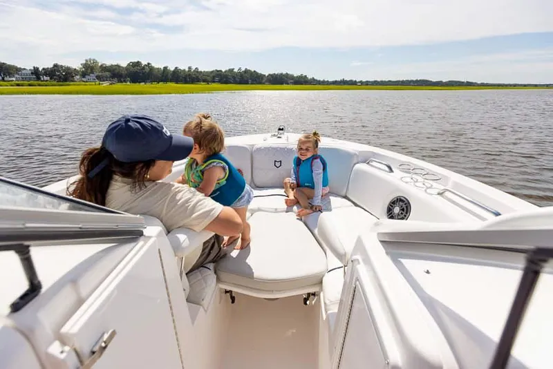 Slide: The Image of Family enjoying a day on the water in a 2025 Sea Fox 228 Traveler boat. - 9