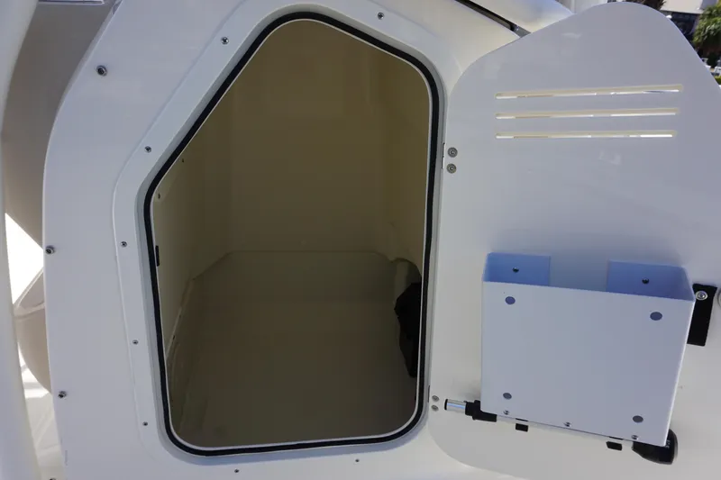 Slide: The Image of Storage compartment on a 2024 Boston Whaler 210 Montauk boat. - 11