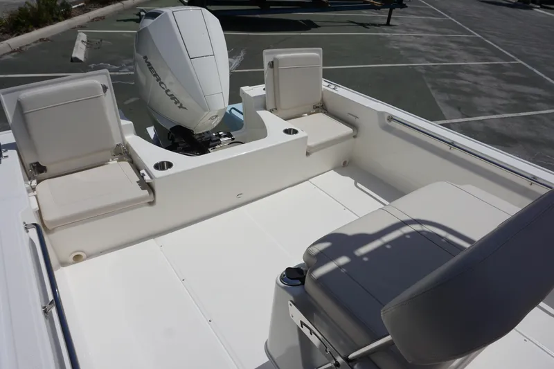 Slide: The Image of 2024 Boston Whaler 210 Montauk boat interior with Mercury outboard engine. - 12
