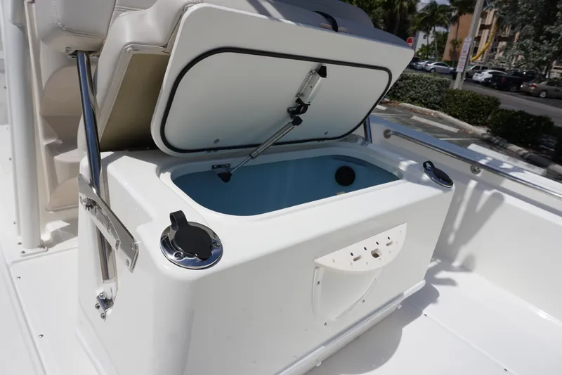 Slide: The Image of 2024 Boston Whaler 210 Montauk boat with open storage compartment. - 9