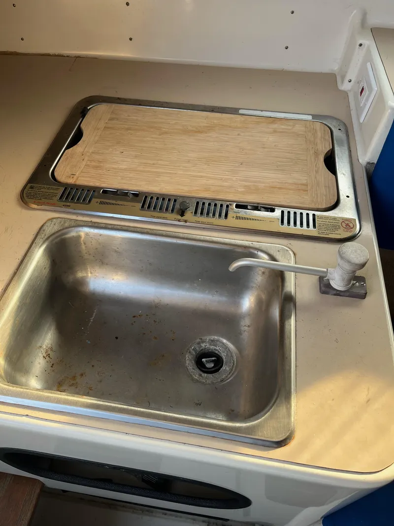Slide: The Image of 1991 Corsair F27 kitchen sink with cutting board and faucet. - 8