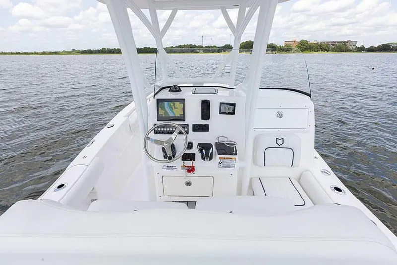 Slide: The Image of 2025 Sea Fox 248 Side Console boat interior with steering wheel and navigation system. - 17