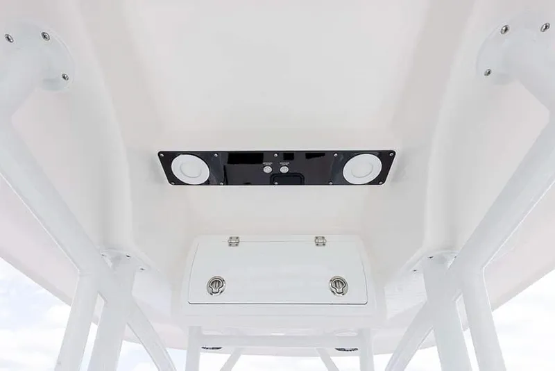 Slide: The Image of 2025 Sea Fox 248 Side Console boat interior ceiling with speakers and storage. - 19