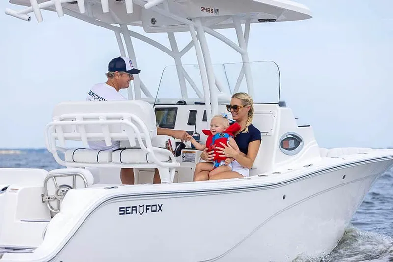 Slide: The Image of 2025 Sea Fox 248 Side Console boat with family enjoying a ride on the water. - 5