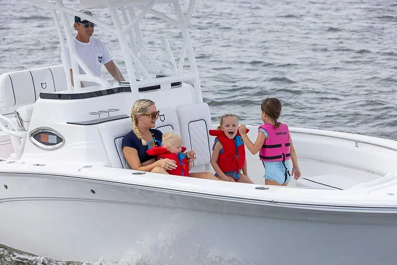Slide: The Image of Family enjoying a ride on a 2025 Sea Fox 248 Side Console boat. - 7