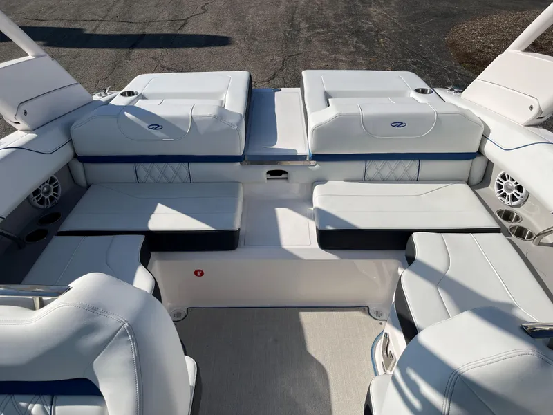 Slide: The Image of 2024 Regal LS2 boat interior with white seating and modern design. - 11