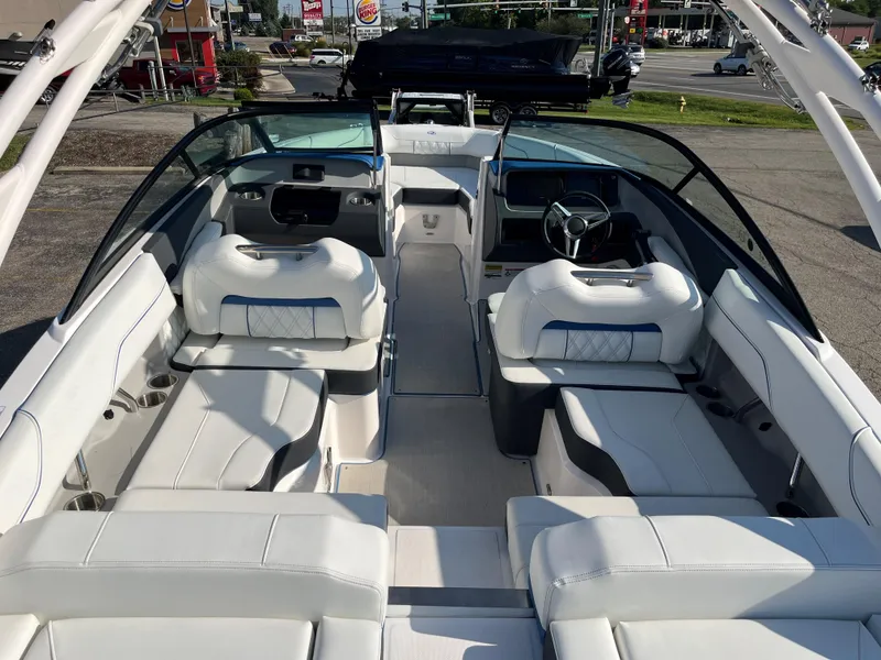 Slide: The Image of 2024 Regal LS2 boat interior with white seating and modern dashboard. - 3