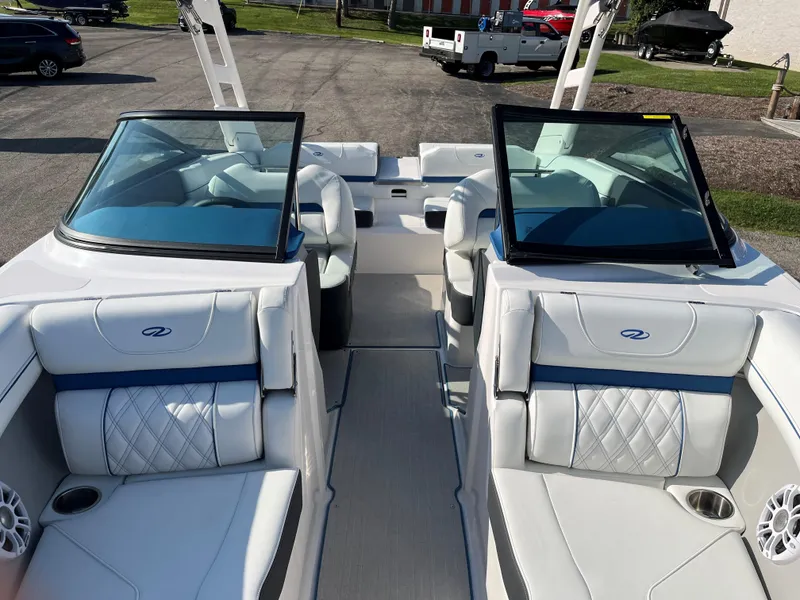 Slide: The Image of 2024 Regal LS2 boat interior with white leather seats and dual windshields. - 5