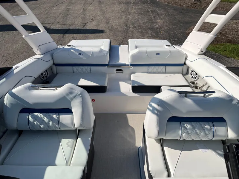 Slide: The Image of 2024 Regal LS2 boat interior with white leather seating and modern design. - 6
