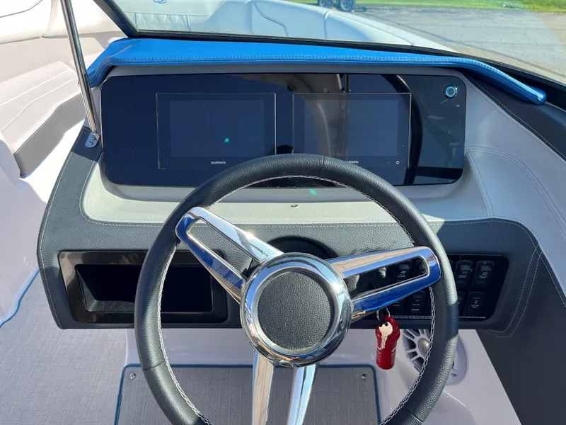 Slide: The Image of 2024 Regal LS2 boat dashboard with modern steering wheel and digital displays. - 8