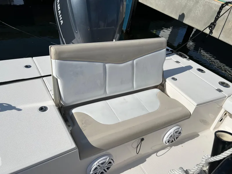 Slide: The Image of 2018 Robalo 246 Cayman boat with powerful engine cruising on open water. - 14