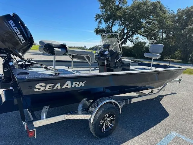 Slide: The Image of 2024 SeaArk RXT 180 boat on trailer with Suzuki outboard motor. - 3
