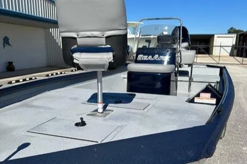 Slide: The Image of 2024 SeaArk RXT 180 boat interior with seating and storage compartments. - 9